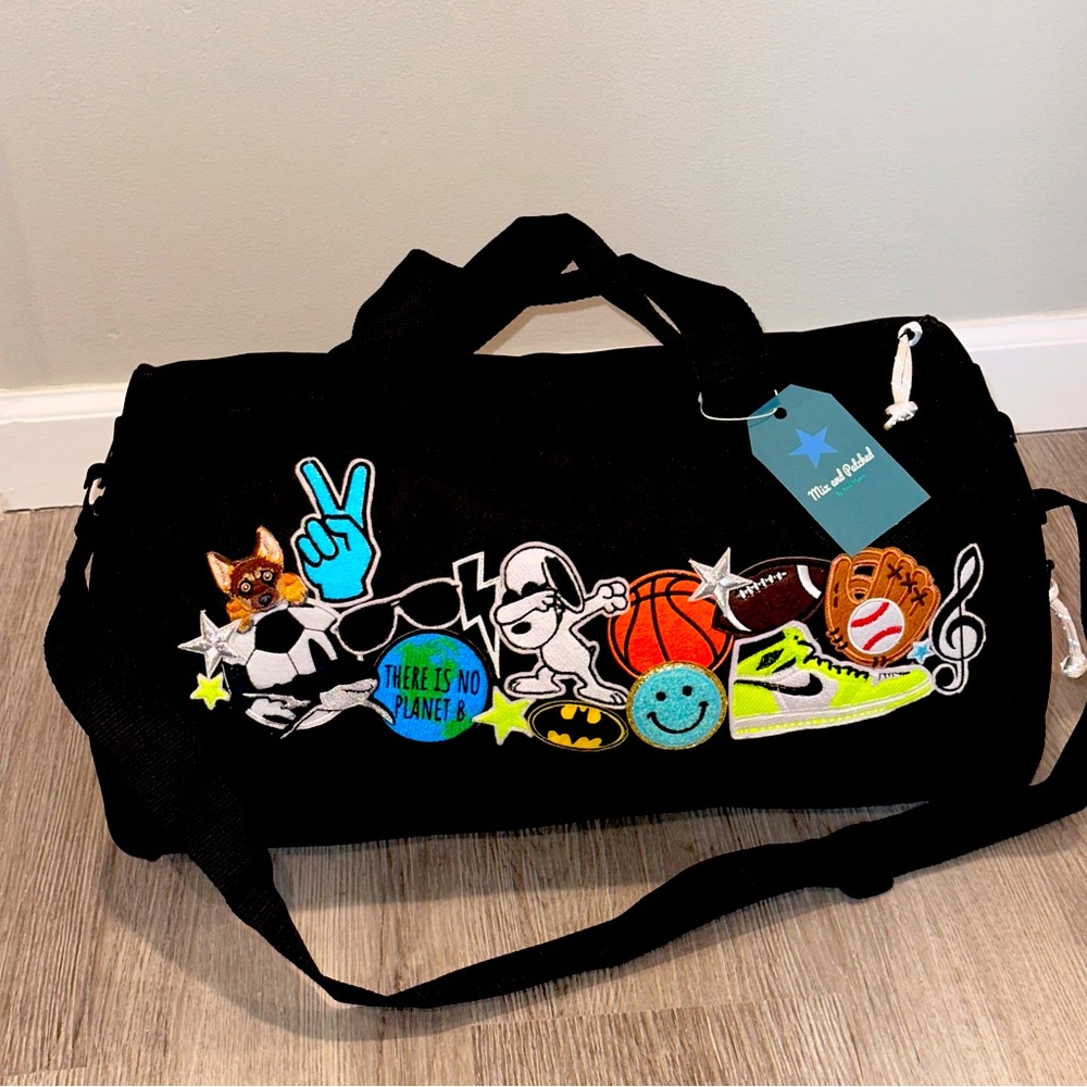 NWT Kids duffle bag with embroidery patches. Black.